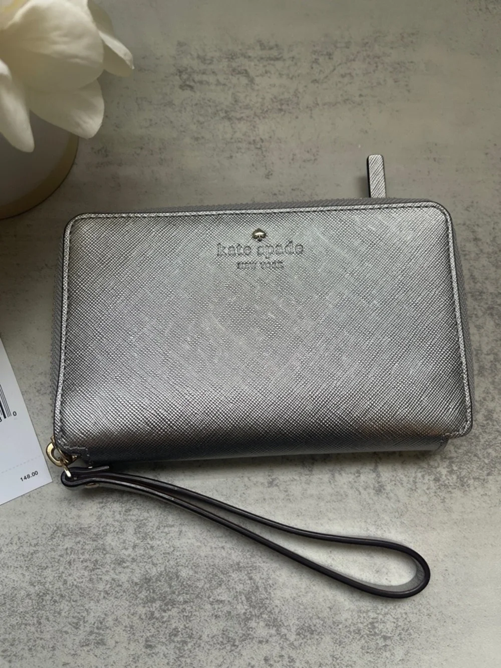 Kate Spade Laurie silver zip-around wristlet wallet